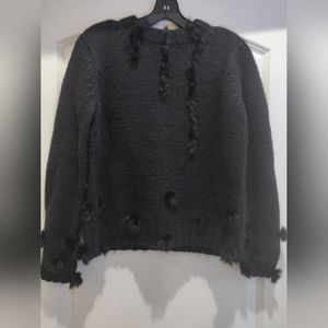 Lord and Taylor black wool sweater with black fur embellishments.